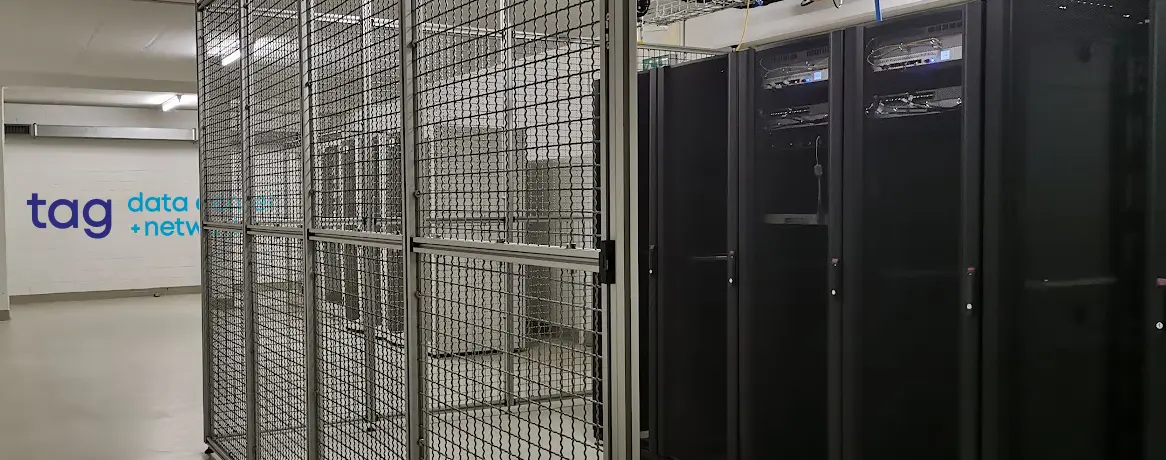 Server racks and caged colocation space in TAG's Liechtenstein data center